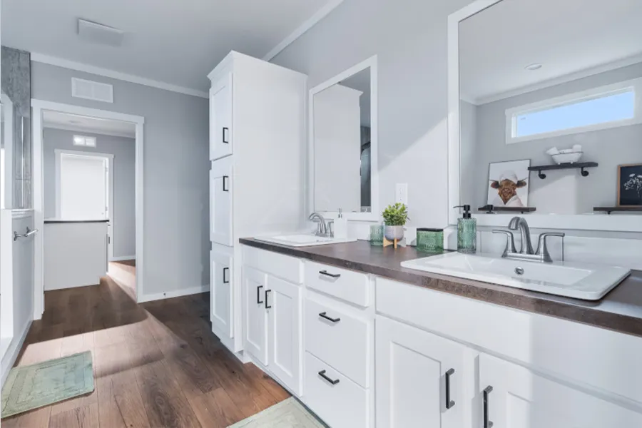The THE OLYMPUS Primary Bathroom. This Manufactured Mobile Home features 4 bedrooms and 3 baths.
