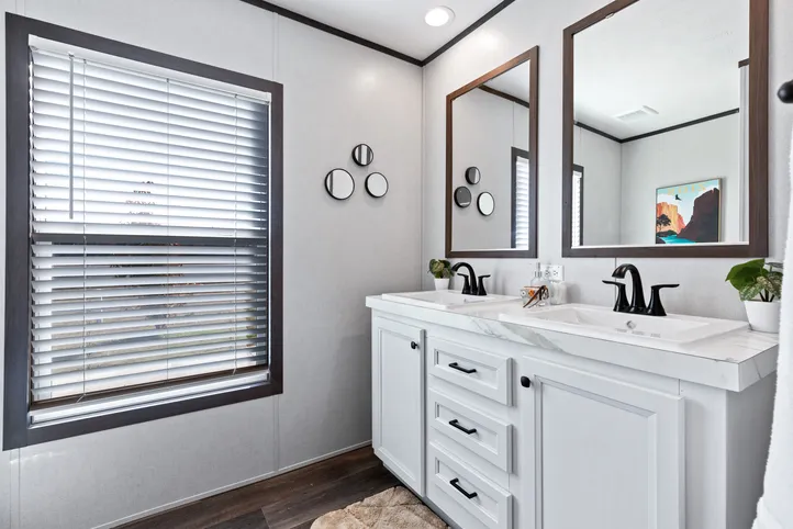 The BREEZE FARMHOUSE Guest Bathroom. This Manufactured Mobile Home features 3 bedrooms and 2 baths.