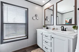 The BREEZE FARMHOUSE Guest Bathroom. This Manufactured Mobile Home features 3 bedrooms and 2 baths.