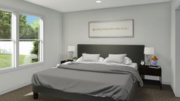 The ROCKET MAN Primary Bedroom. This Manufactured Mobile Home features 3 bedrooms and 2 baths.