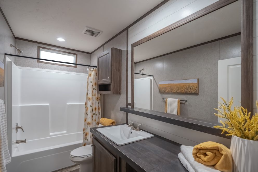 The LOCKLEAR Exterior. This Manufactured Mobile Home features 4 bedrooms and 2 baths.