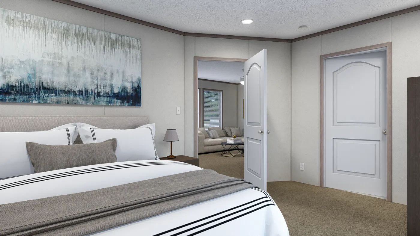 The 4824-E734 THE PULSE Primary Bedroom. This Manufactured Mobile Home features 3 bedrooms and 2 baths.