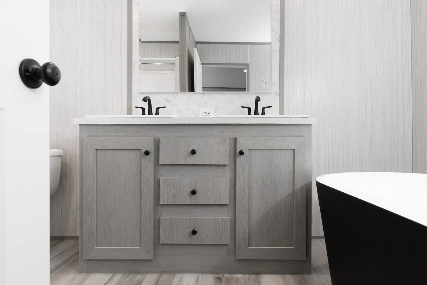 The THE ANNIVERSARY 76 Primary Bathroom. This Manufactured Mobile Home features 3 bedrooms and 2 baths.