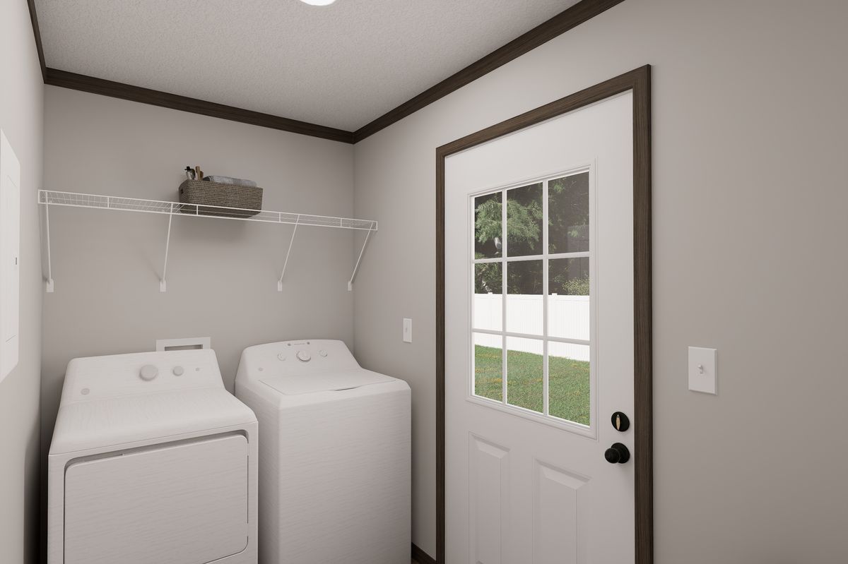The THE TRUMAN Utility Room. This Manufactured Mobile Home features 3 bedrooms and 2 baths.