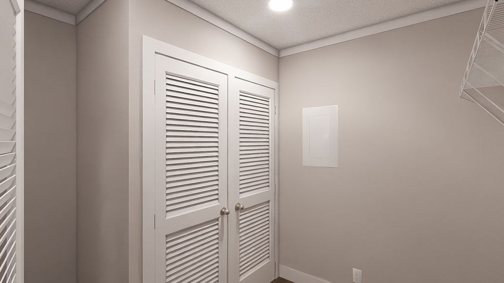 The LET IT BE Utility Room. This Manufactured Mobile Home features 3 bedrooms and 2 baths.