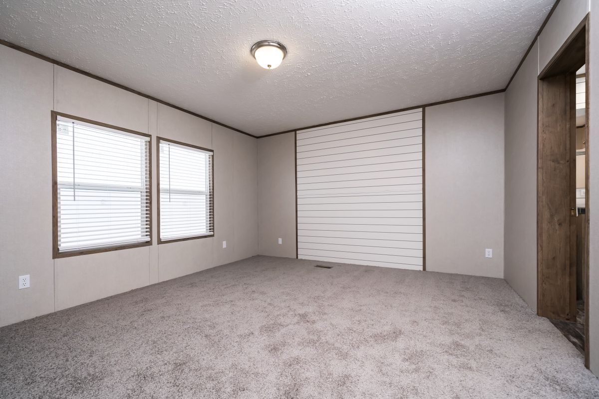 The ANNIVERSARY 56 Exterior. This Manufactured Mobile Home features 3 bedrooms and 2 baths.