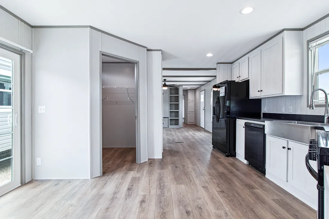 The ANNIVERSARY 16682F Kitchen. This Manufactured Mobile Home features 2 bedrooms and 2 baths.