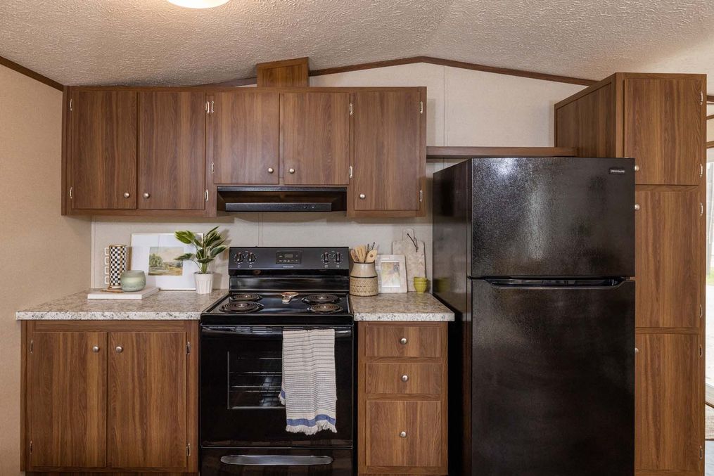 The CELEBRATION Kitchen. This Manufactured Mobile Home features 3 bedrooms and 2 baths.