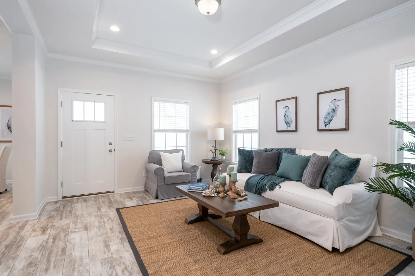 The 2889 THE COTTAGE HUD Living Room. This Manufactured Mobile Home features 3 bedrooms and 2 baths.