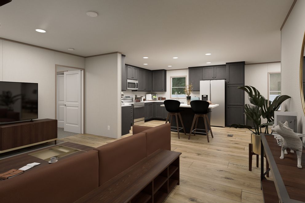 The ULTRA FLEX Living Room. This Manufactured Mobile Home features 4 bedrooms and 2 baths.