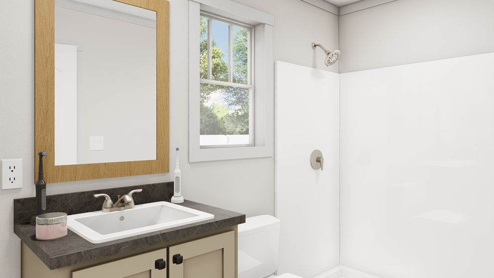 The RESPECT Primary Bathroom. This Manufactured Mobile Home features 2 bedrooms and 2 baths.