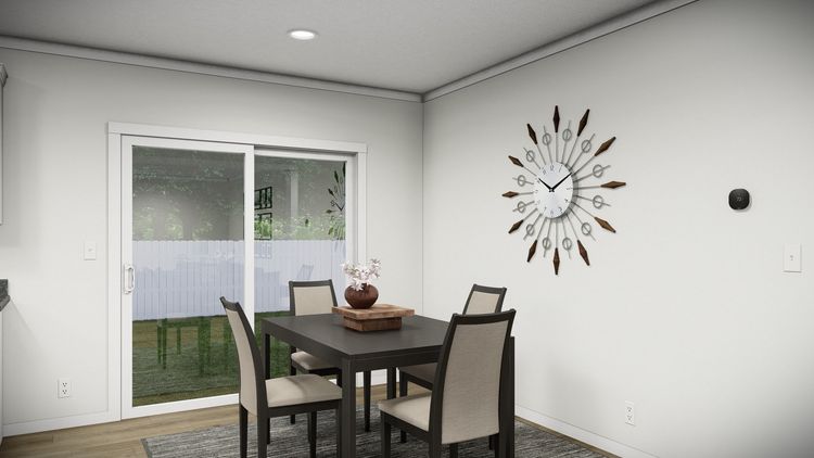 The THE PARKER Dining Area. This Manufactured Mobile Home features 3 bedrooms and 2 baths.