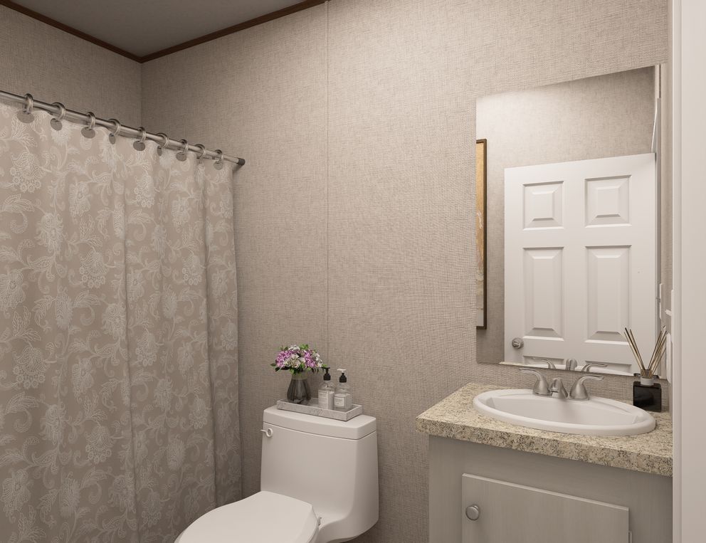 The OAK Guest Bathroom. This Manufactured Mobile Home features 4 bedrooms and 2 baths.