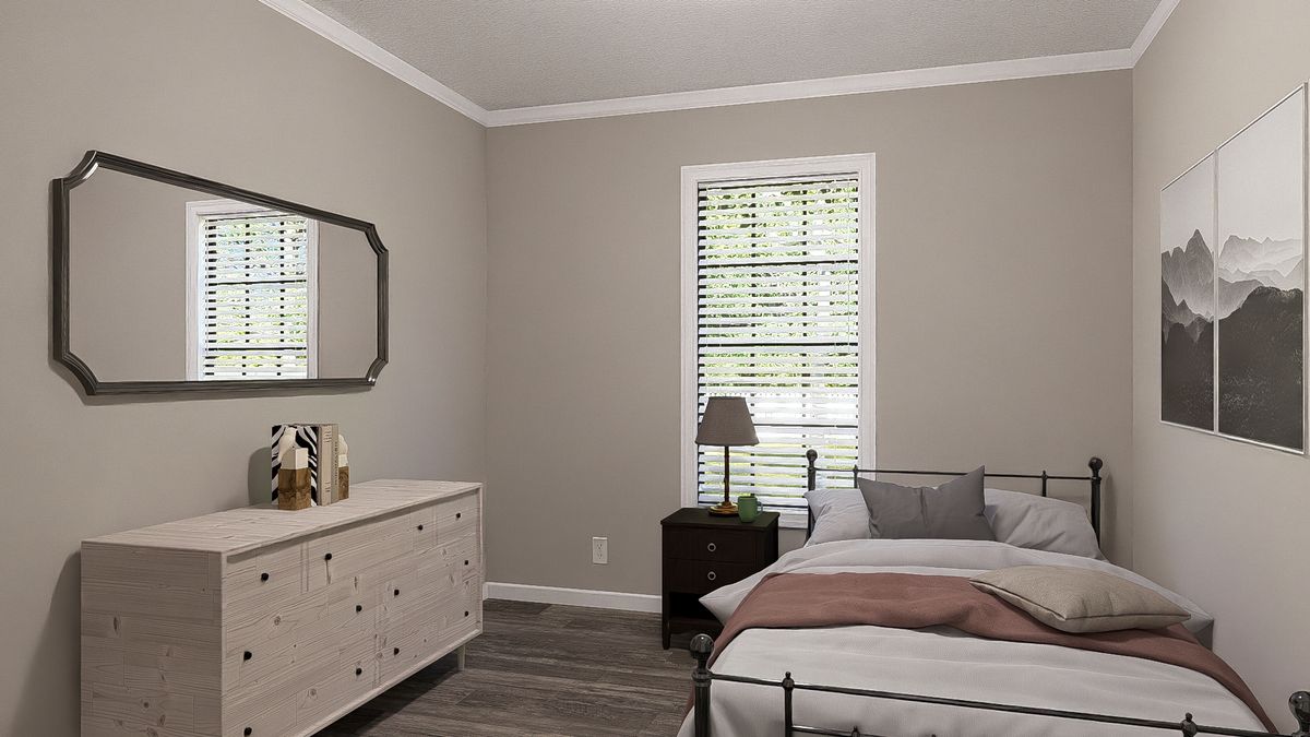 The THE LIL' EASY Bedroom. This Manufactured Mobile Home features 3 bedrooms and 2 baths.