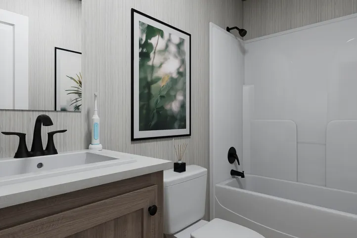 The THE ANNIVERSARY 76 Guest Bathroom. This Manufactured Mobile Home features 3 bedrooms and 2 baths.
