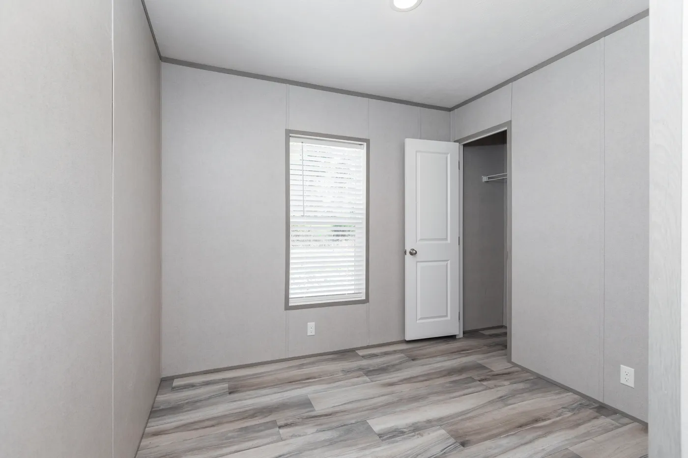 The THE OLYMPUS Guest Bedroom. This Manufactured Mobile Home features 3 bedrooms and 2 baths.