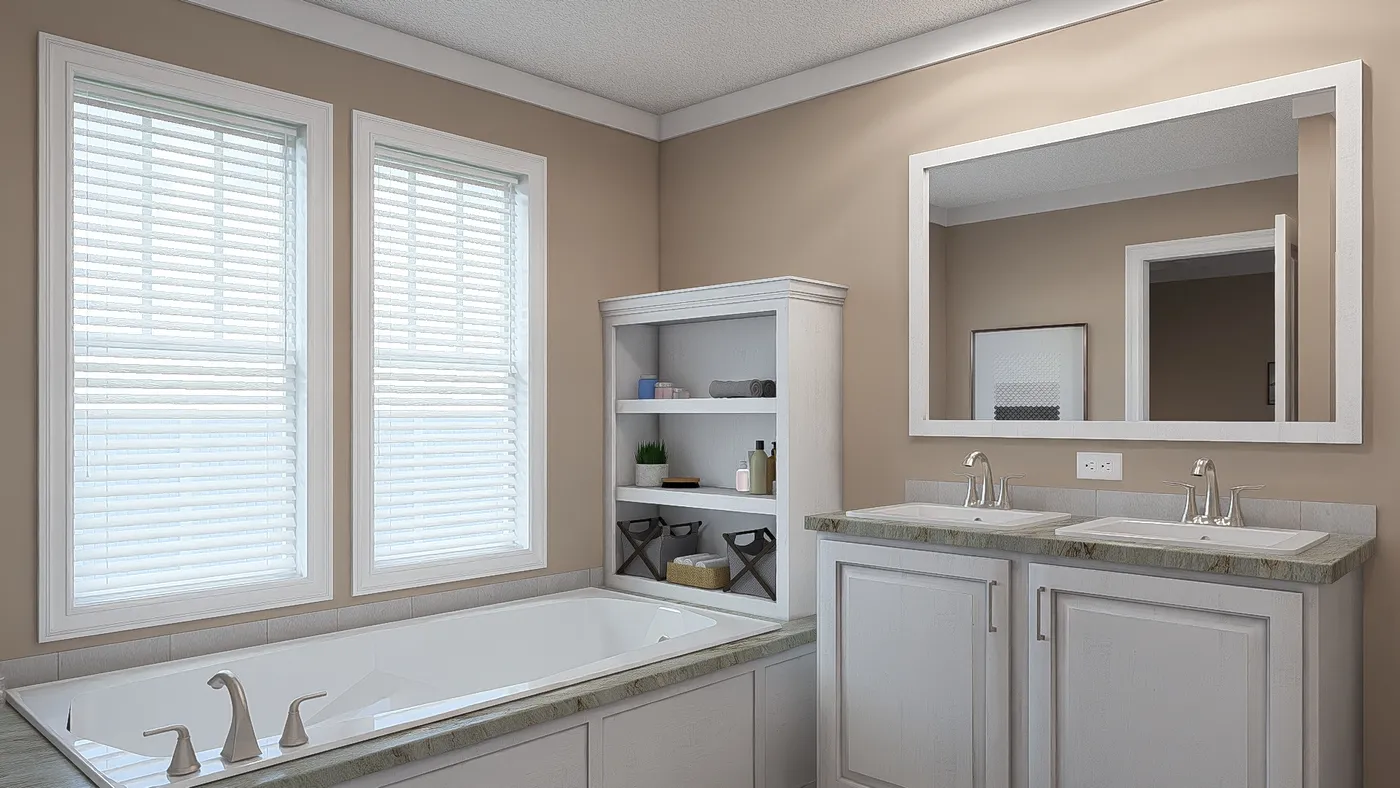 The THE DREAM Primary Bathroom. This Manufactured Mobile Home features 3 bedrooms and 2 baths.