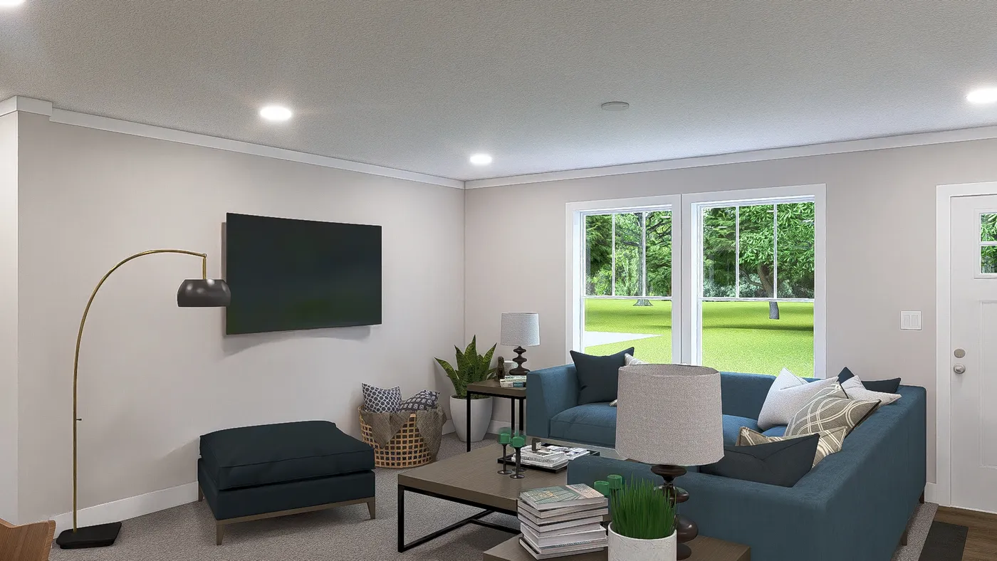 The WONDERFUL WORLD Living Room. This Manufactured Mobile Home features 3 bedrooms and 2 baths.