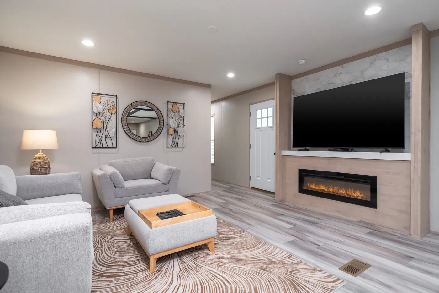 The ANNIVERSARY JEWEL Living Room. This Manufactured Mobile Home features 3 bedrooms and 2 baths.