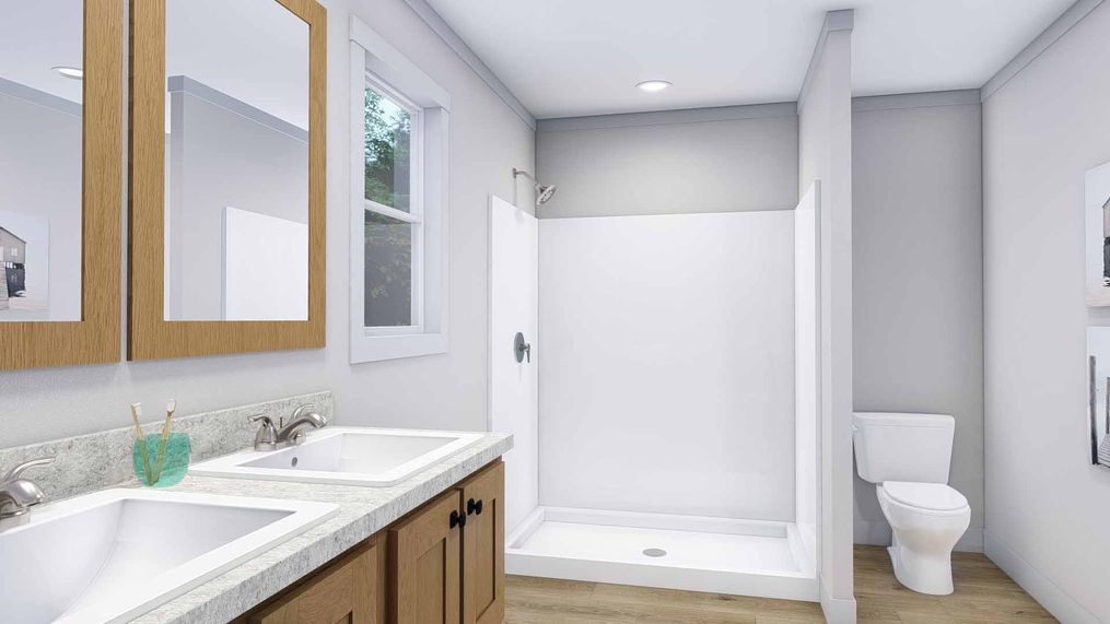 The LOVELY DAY Primary Bathroom. This Manufactured Mobile Home features 4 bedrooms and 2 baths.