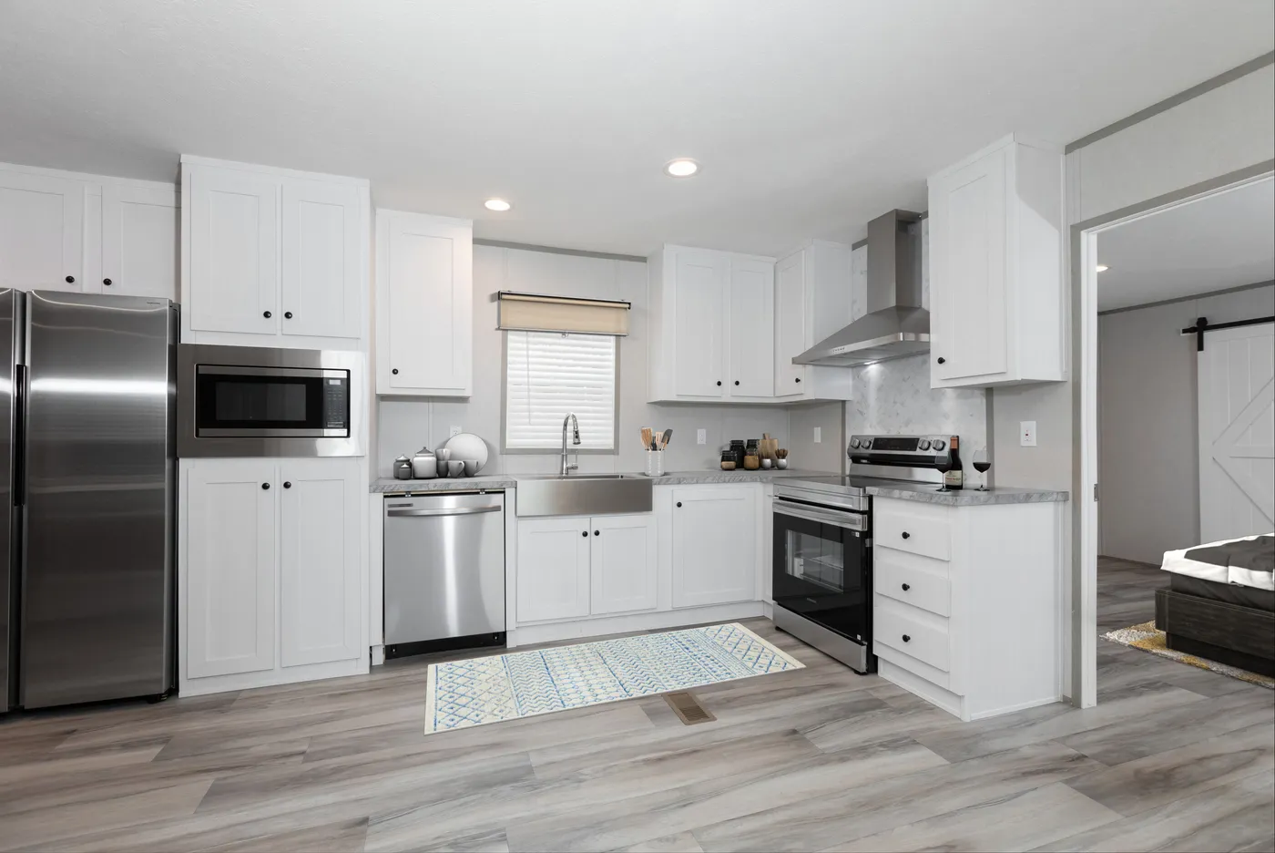 The THE ULTIMATE SHOWER Kitchen. This Manufactured Mobile Home features 3 bedrooms and 2 baths.