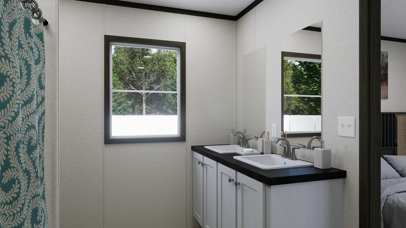 The THE SPARK Primary Bathroom. This Manufactured Mobile Home features 3 bedrooms and 2 baths.