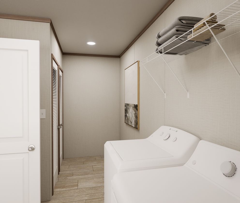 The ULTRA FLEX 60 Utility Room. This Manufactured Mobile Home features 3 bedrooms and 2 baths.