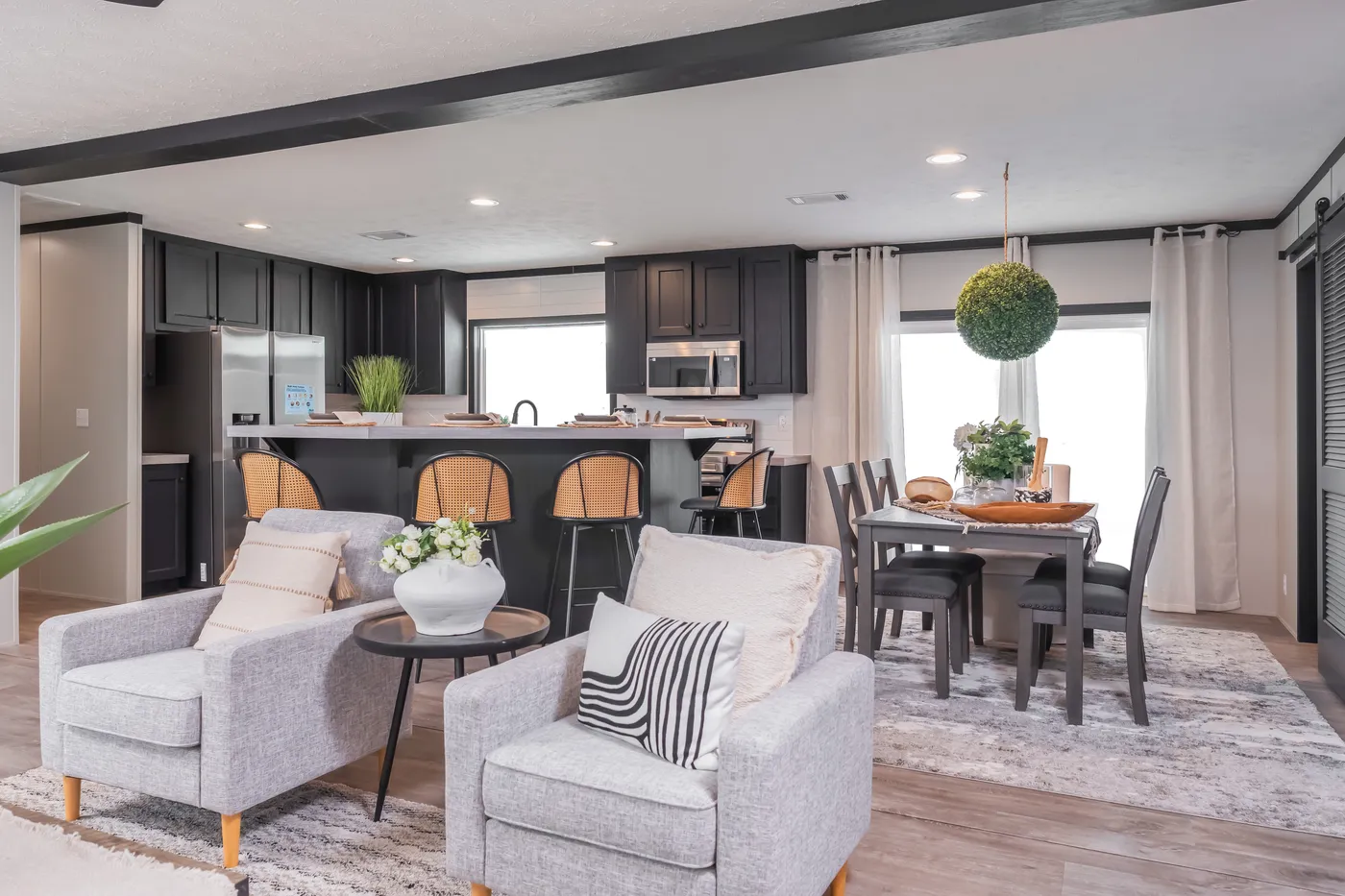 The CRAZY EIGHTS Living Room. This Manufactured Mobile Home features 4 bedrooms and 2 baths.