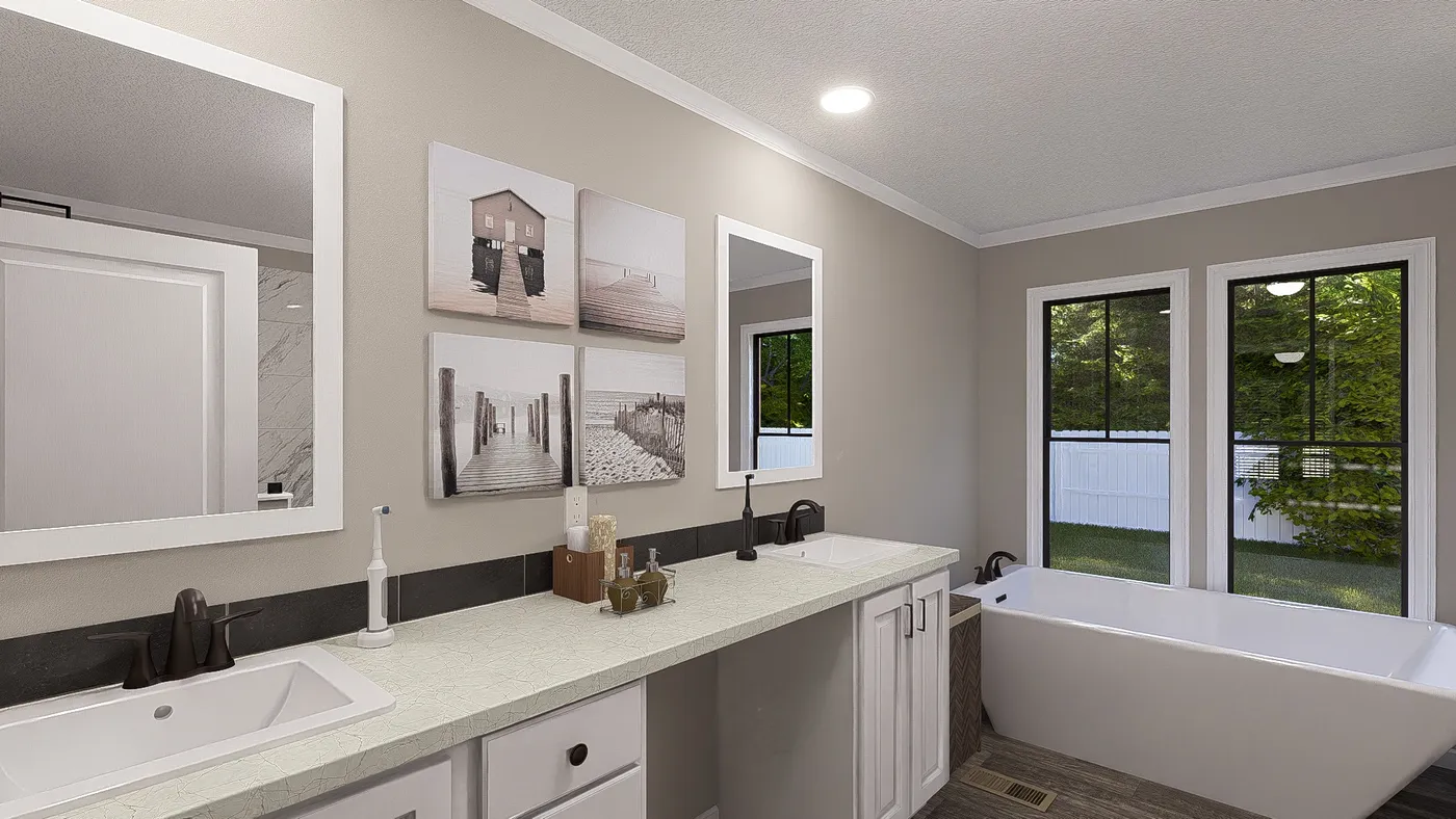 The THE LIL' EASY Primary Bathroom. This Manufactured Mobile Home features 3 bedrooms and 2 baths.