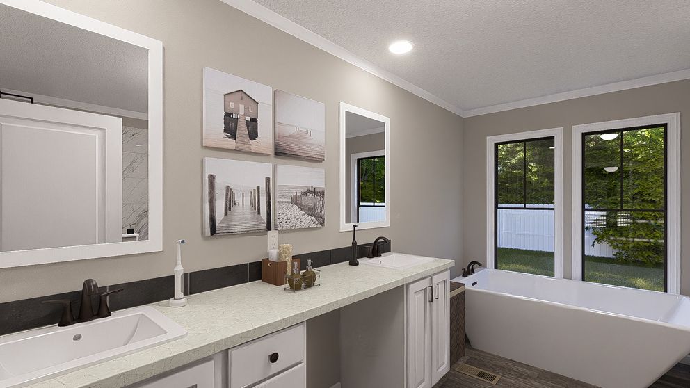 The THE LIL' EASY Primary Bathroom. This Manufactured Mobile Home features 3 bedrooms and 2 baths.