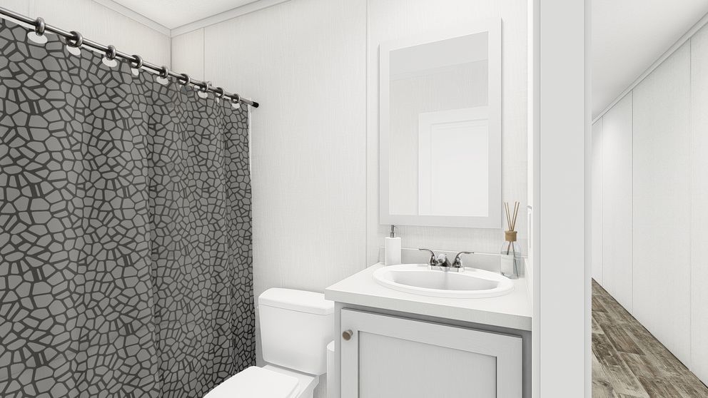 The PERIDOT Guest Bathroom. This Manufactured Mobile Home features 2 bedrooms and 1 bath.
