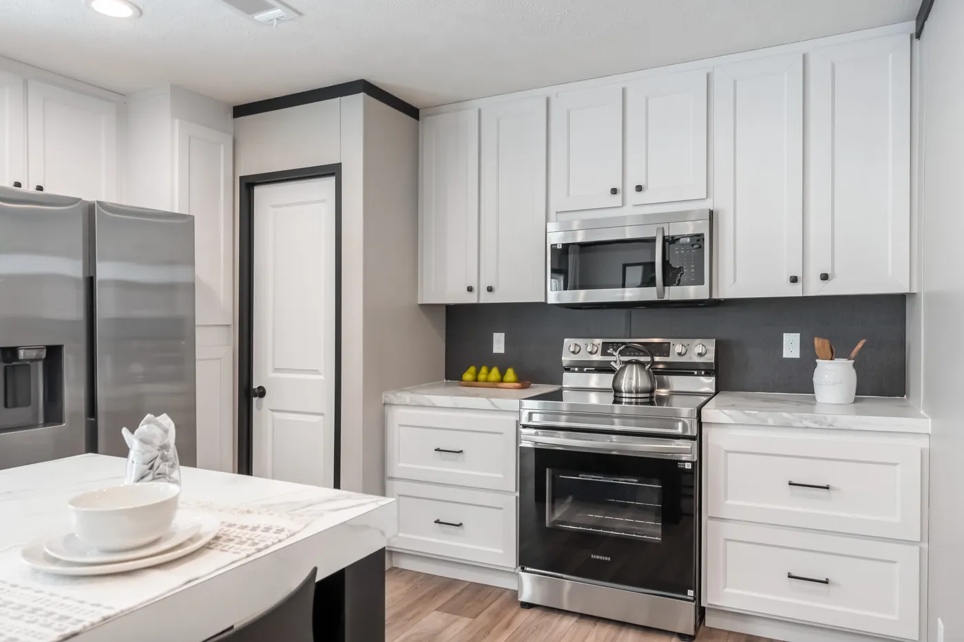 The THE ANNIVERSARY 2.1 Kitchen. This Manufactured Mobile Home features 3 bedrooms and 2 baths.