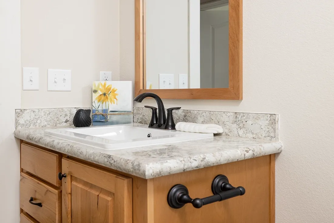 The TH601F                 CLAYTON Guest Bathroom. This Manufactured Mobile Home features 3 bedrooms and 2 baths.