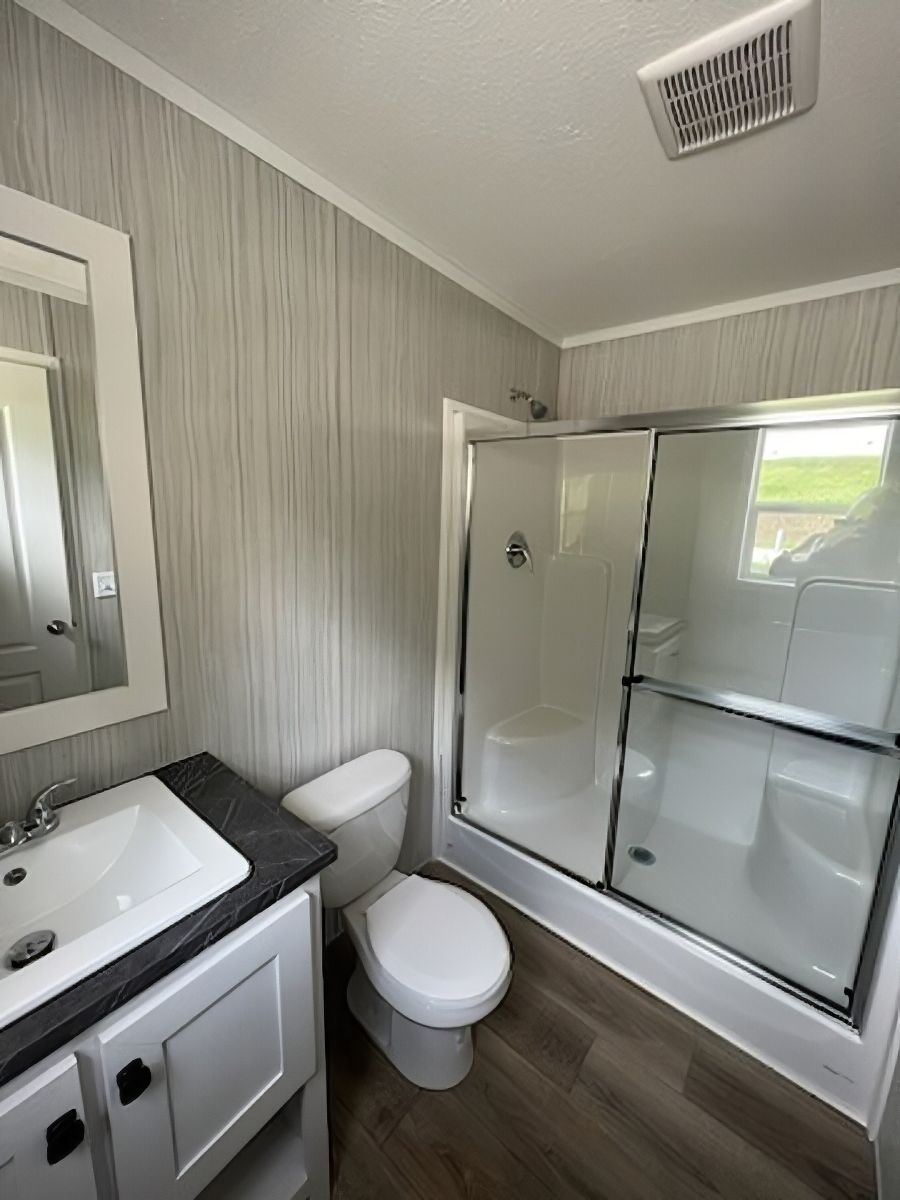 The JADE 48 Primary Bathroom. This Manufactured Mobile Home features 3 bedrooms and 2 baths.