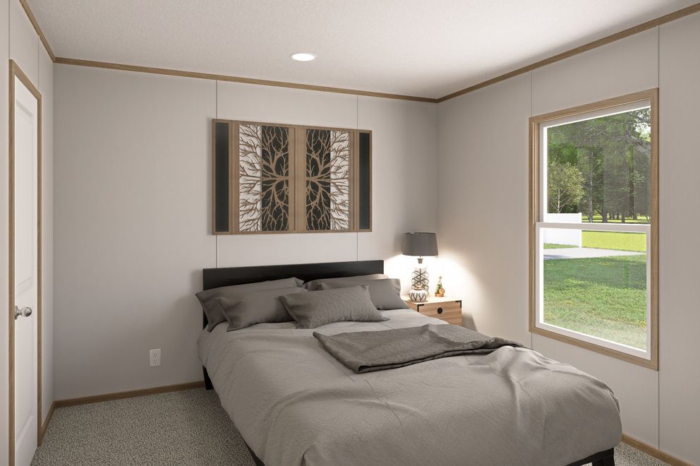 The THE EAGLE 60 Bedroom. This Manufactured Mobile Home features 3 bedrooms and 2 baths.