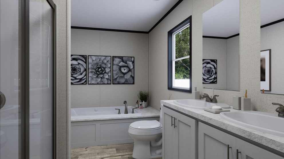 The THE MOUNTAINEER 52 Primary Bathroom. This Manufactured Mobile Home features 3 bedrooms and 2 baths.