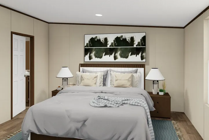 The SATISFACTION Primary Bedroom. This Manufactured Mobile Home features 3 bedrooms and 2 baths.