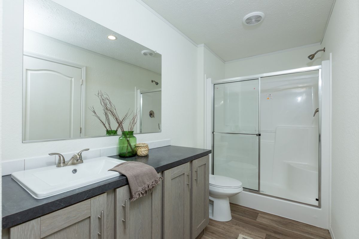 The LIFESTYLE 208 Primary Bathroom. This Manufactured Mobile Home features 3 bedrooms and 2 baths.