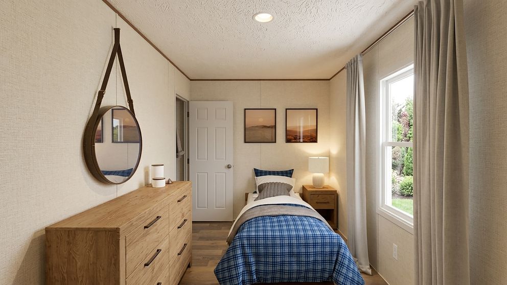 The ASPEN Guest Bedroom. This Manufactured Mobile Home features 3 bedrooms and 2 baths.
