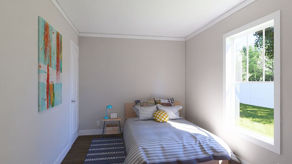 The MOVE ON UP Guest Bedroom. This Manufactured Mobile Home features 3 bedrooms and 2 baths.