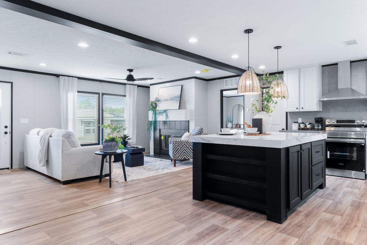 The ABSOLUTE VALUE Living Room. This Manufactured Mobile Home features 4 bedrooms and 2 baths.