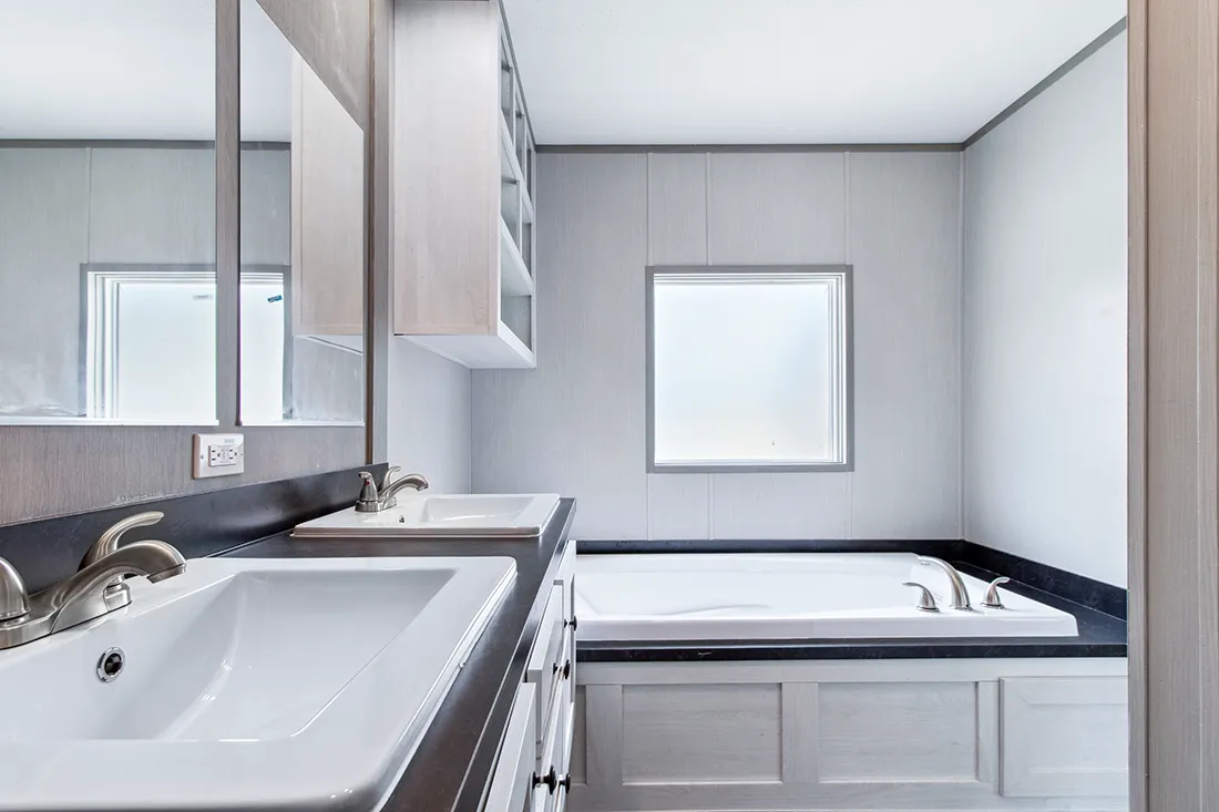The ANNIVERSARY 16682F Primary Bathroom. This Manufactured Mobile Home features 2 bedrooms and 2 baths.