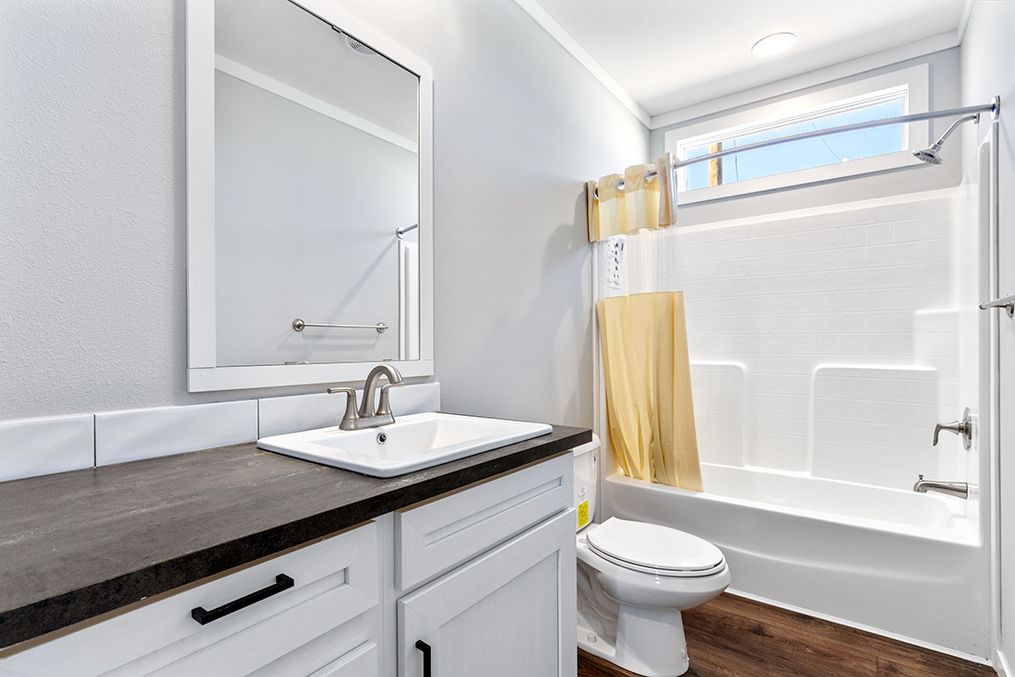 The THE VAIL Guest Bathroom. This Manufactured Mobile Home features 3 bedrooms and 2 baths.