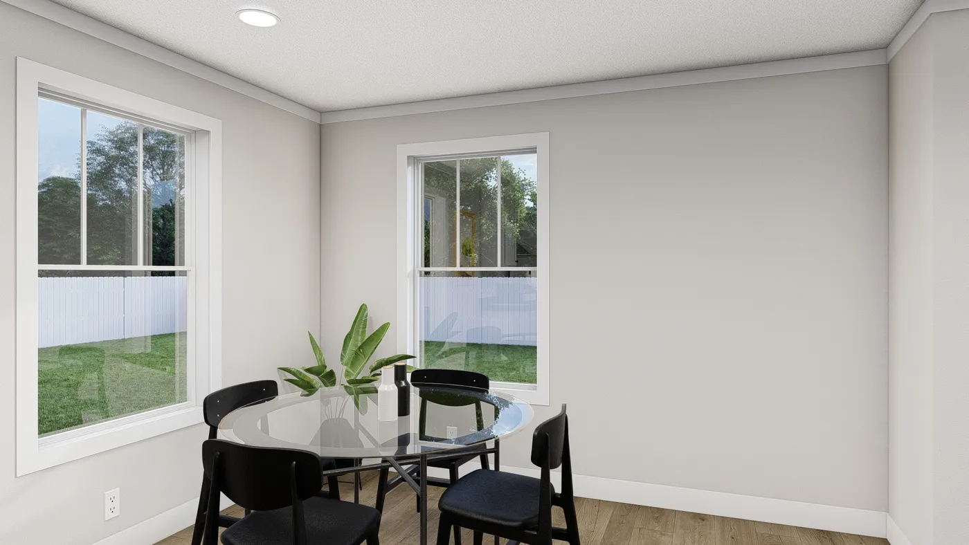 The THREE LITTLE BIRDS Dining Room. This Manufactured Mobile Home features 3 bedrooms and 2 baths.