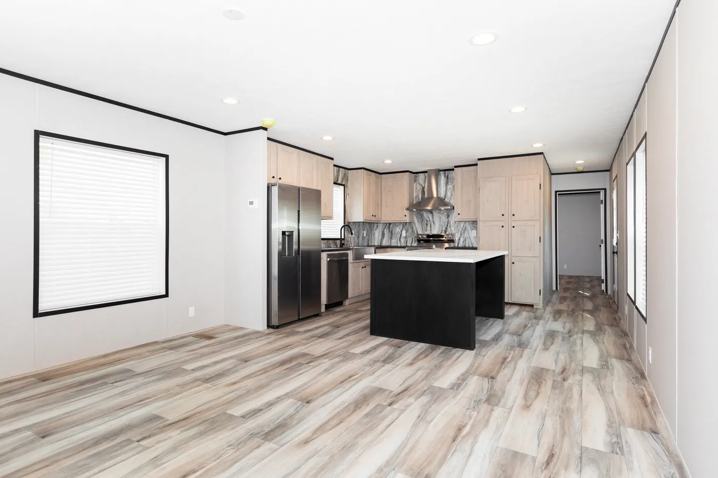 The THE FUJI Living Room. This Manufactured Mobile Home features 3 bedrooms and 2 baths.