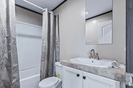 The THE GRAND Guest Bathroom. This Manufactured Mobile Home features 3 bedrooms and 2 baths.