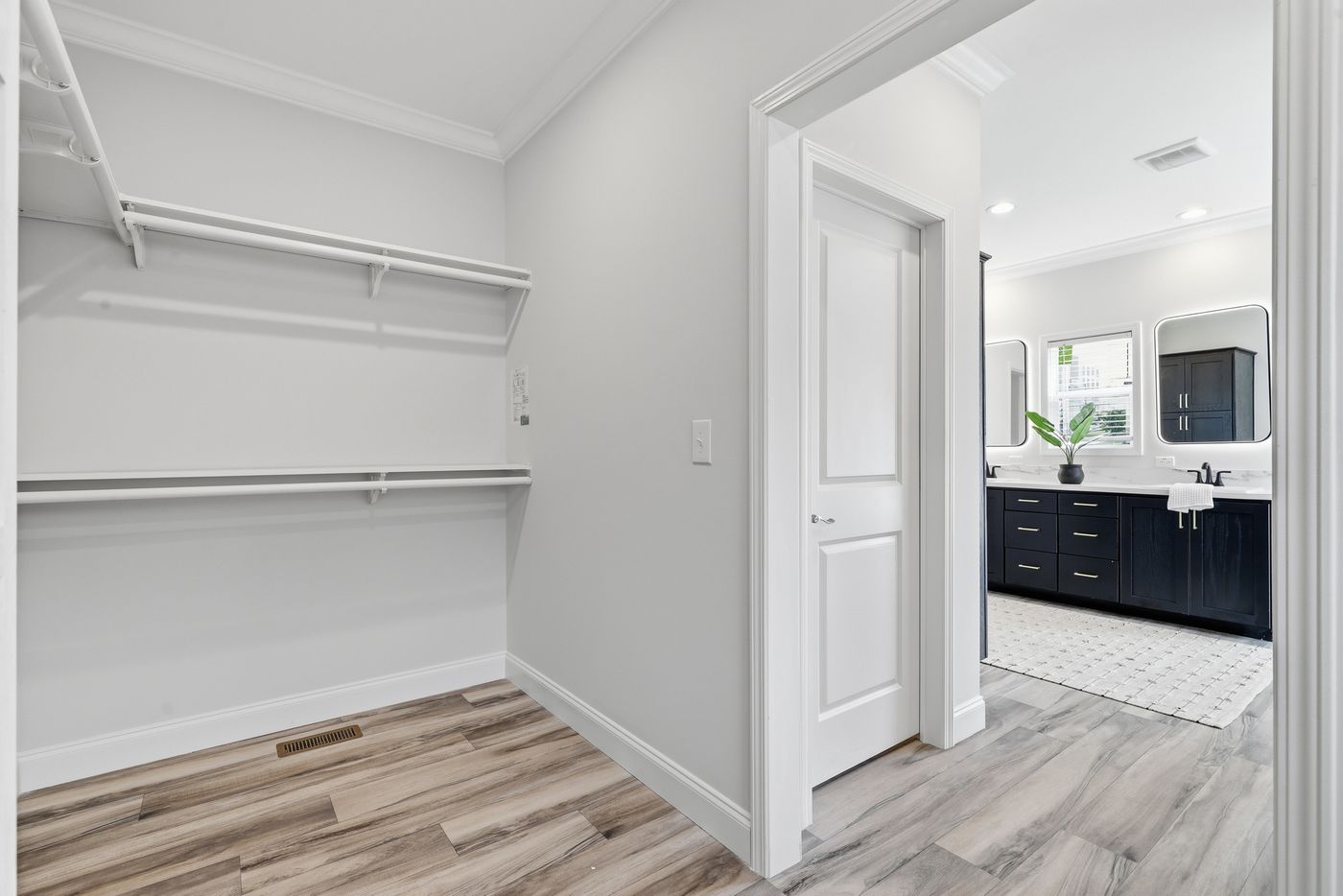 The THE SUMMIT Primary Bedroom. This Manufactured Mobile Home features 3 bedrooms and 2 baths.