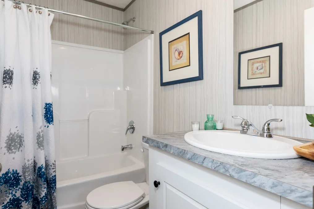 The BLAZER 76 F Guest Bathroom. This Manufactured Mobile Home features 3 bedrooms and 2 baths.