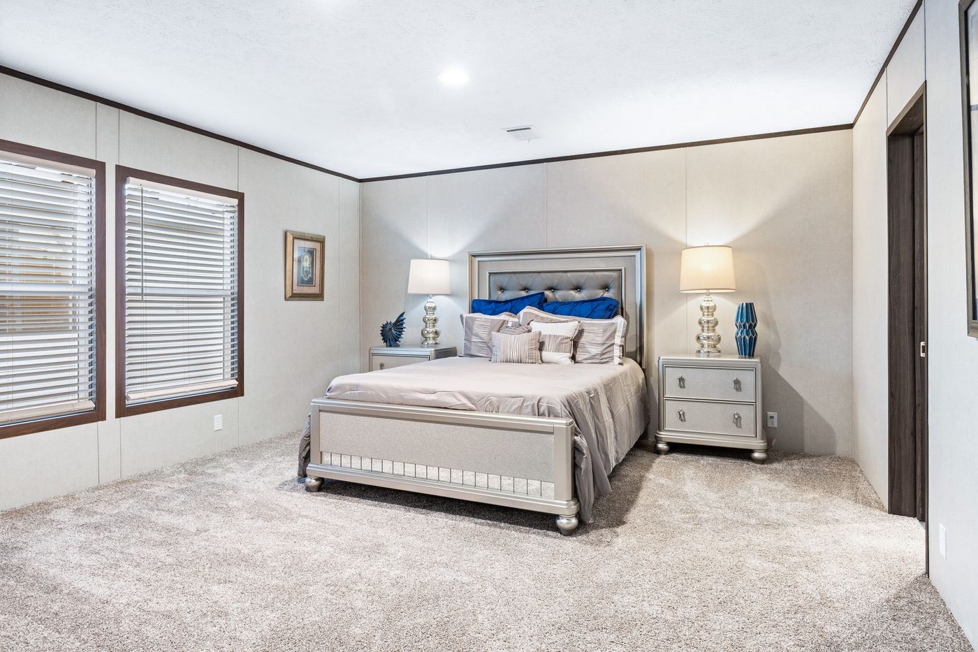 The HERCULES Primary Bedroom. This Manufactured Mobile Home features 4 bedrooms and 2 baths.