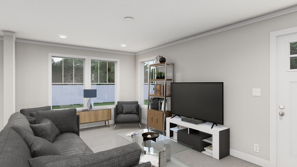 The THREE LITTLE BIRDS Living Room. This Manufactured Mobile Home features 3 bedrooms and 2 baths.